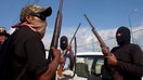 The vigilante group forced teenagers acting as cartel lookouts to do community service as street sweepers.